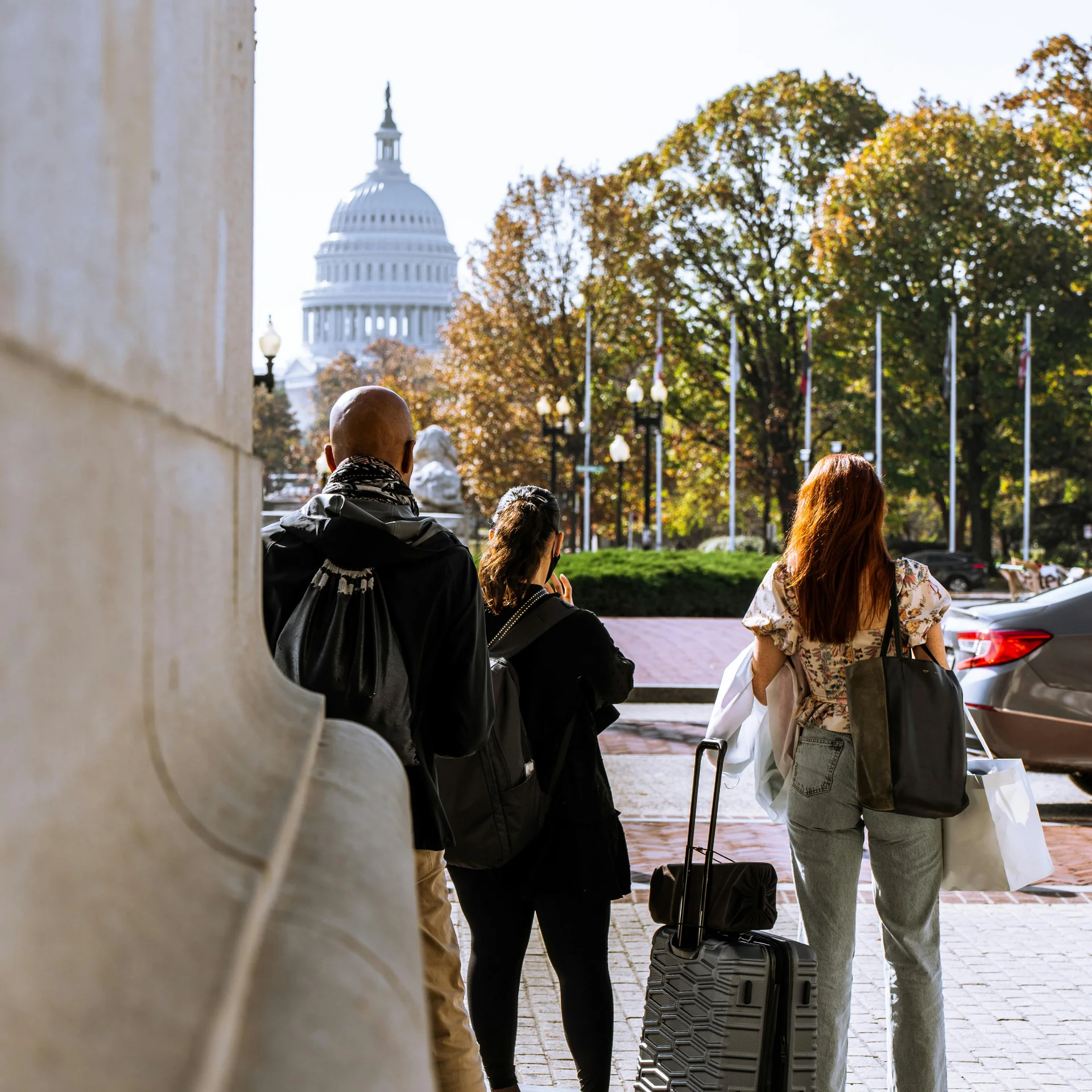 People standing at Union Station, Washington DC looking at the nation's Capitol Building.