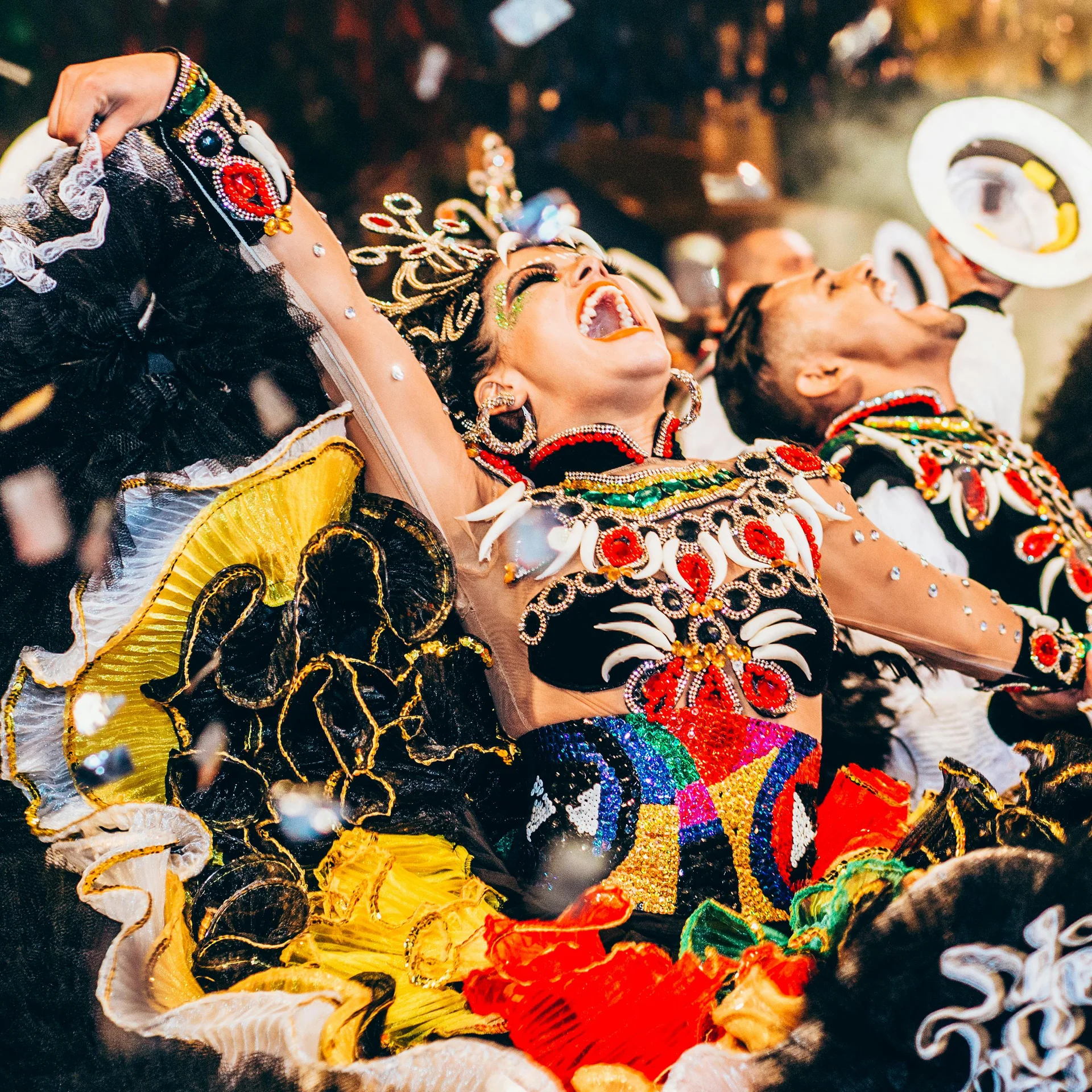Singing and celebration in costume from Rio Carnival in Brazil